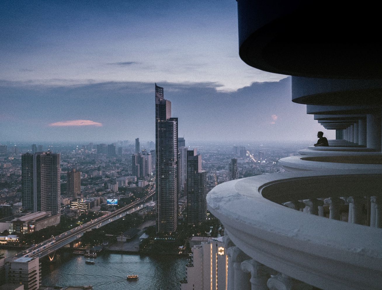 Bangkok skyline under a dark sky