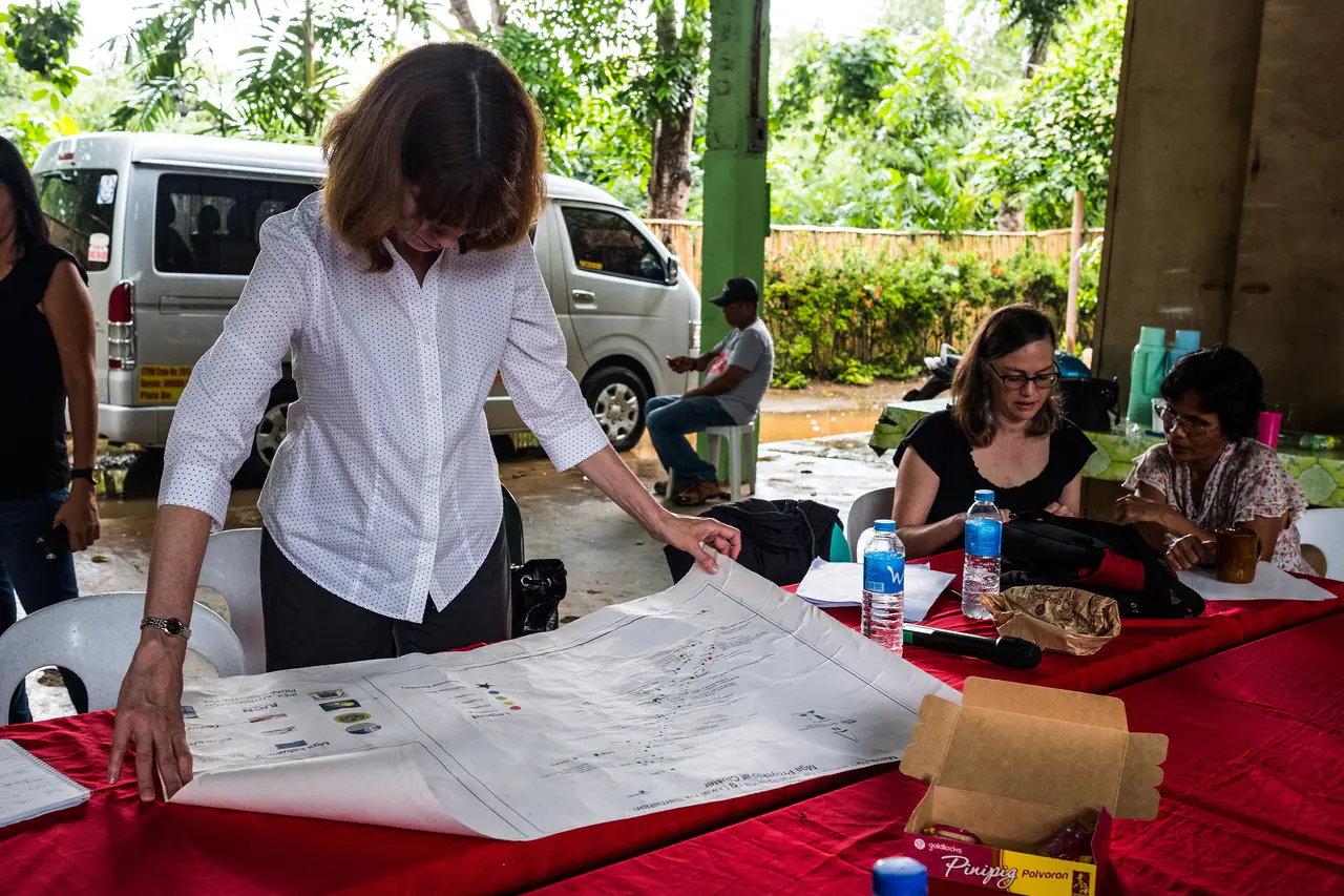July 2017. Ann Koontz of the USAID Conservation Enterprise Retrospective team meeting at the the Nagkakaisang Tribu ng Palawan (NATRIPAL) or the United Tribes of Palawan offices with Palawan indiginious tribal communities from Campung Ulay and Punta Baja, both in southern Palawan near Rizal, to discuss their lives and liveihoods in the context of enterprise projects and environmental considerations. Puerto Princesa, Palawan, Philippines. Photograph by Jason Houston for USAID