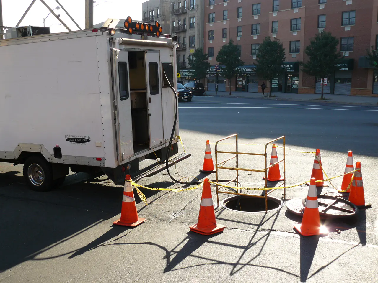 A fiber optic splice lab being used to access underground fiber optic cables for splicing.