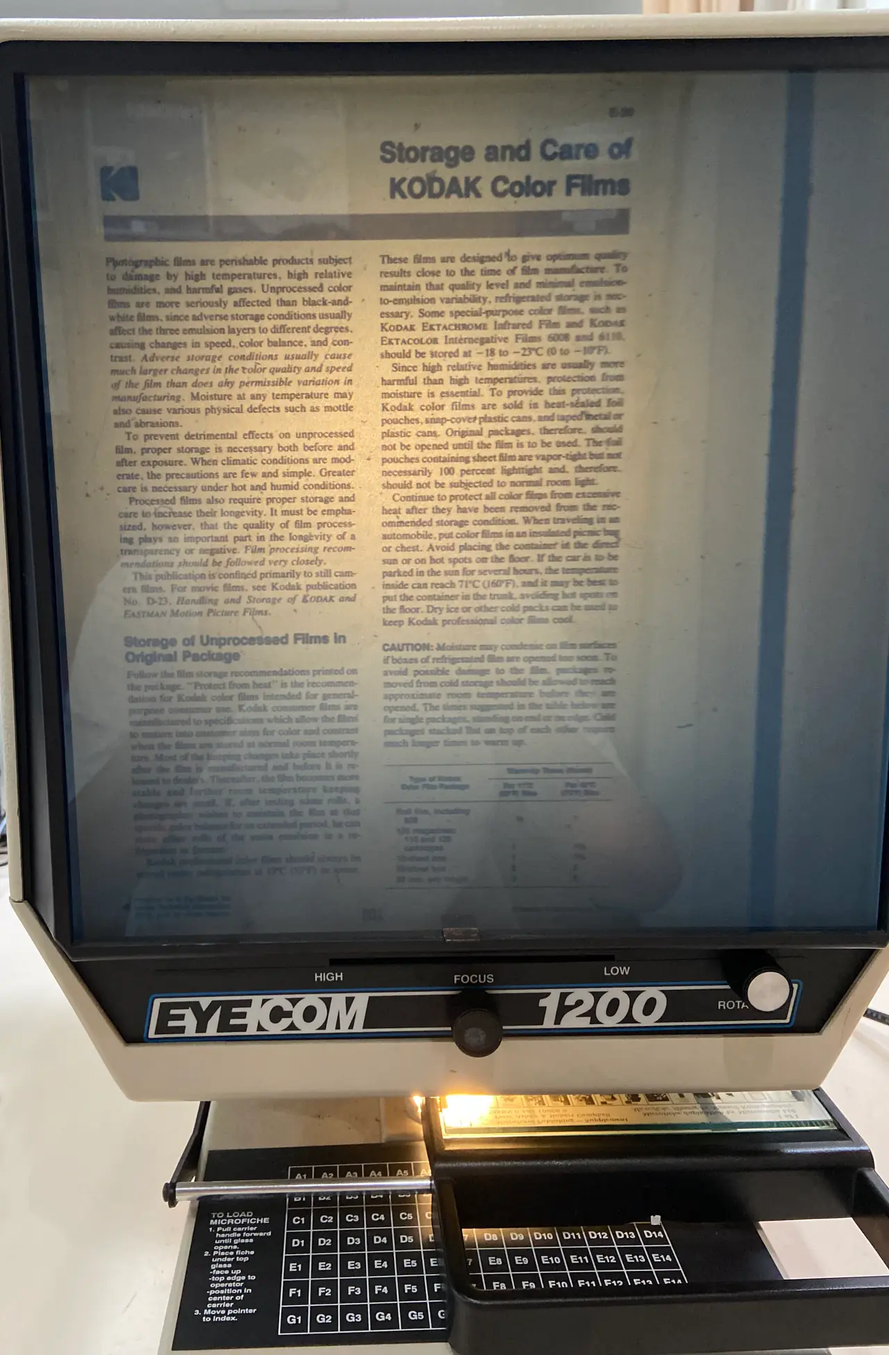EYECOM 1200 microfiche reader reading a page of kodak publication. Note that this reader's lens is knocked out of alignment, but still serves the purpose of illustration sufficiently. Picture taken at Shanghai Library in China.