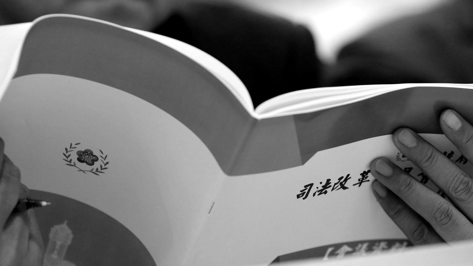 Hands on an open document during a working session