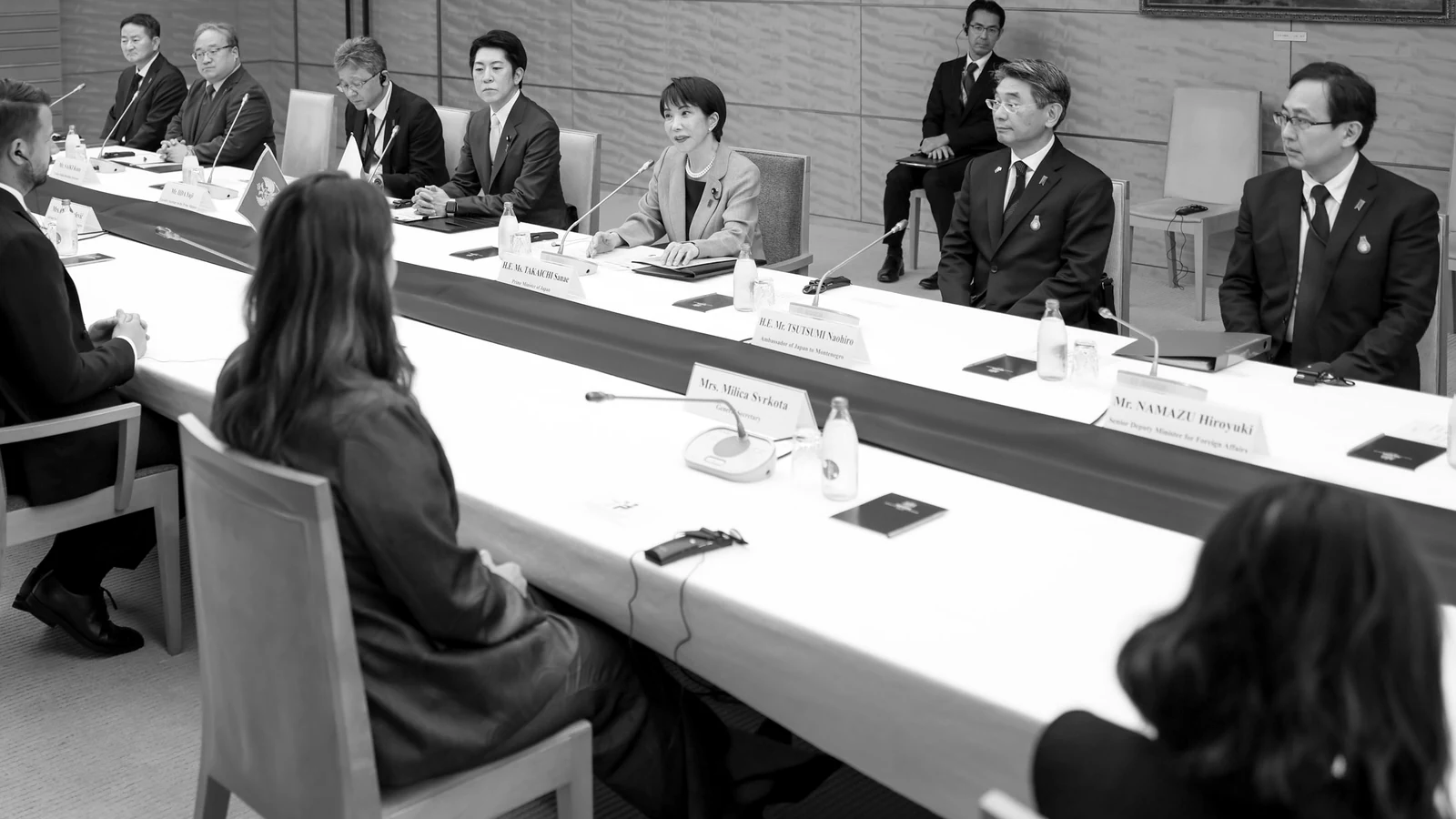A delegation meeting across the table