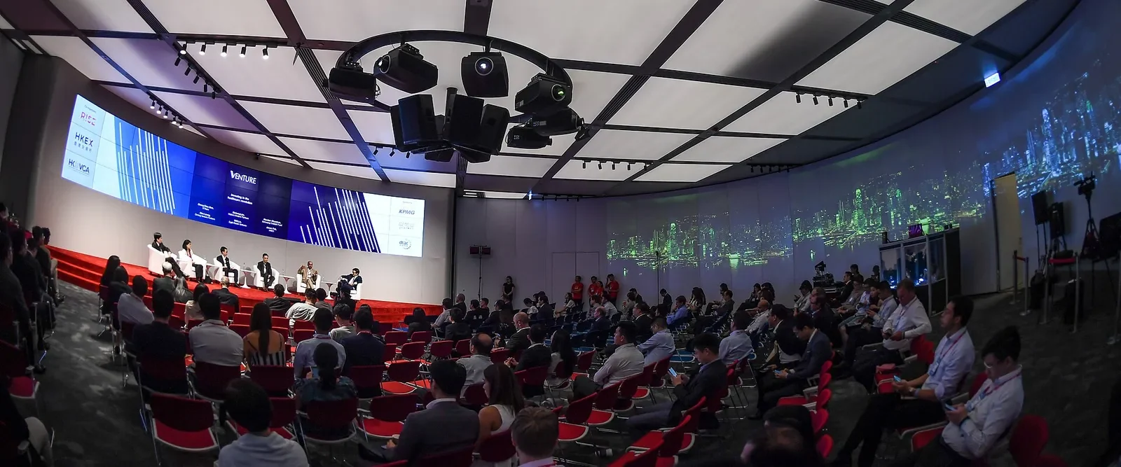 Panel and seated audience in the HKEX forum hall before RISE 2018, Hong Kong · editorial context