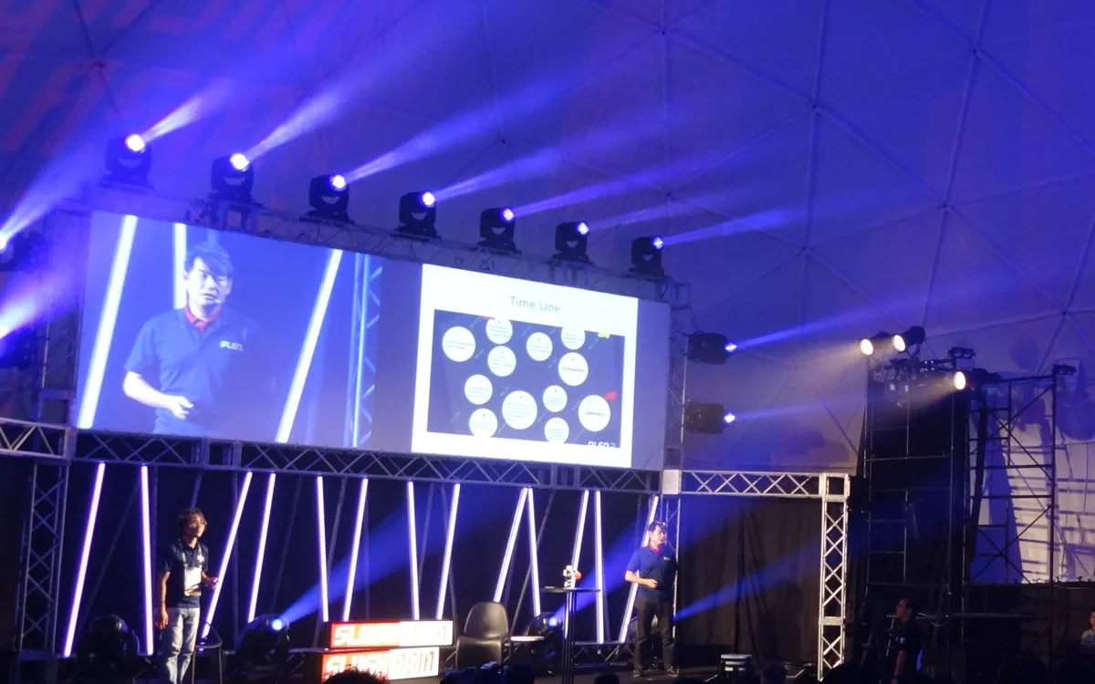 Speaker and projected session on the main stage at Slush Asia 2015, Tokyo · editorial context