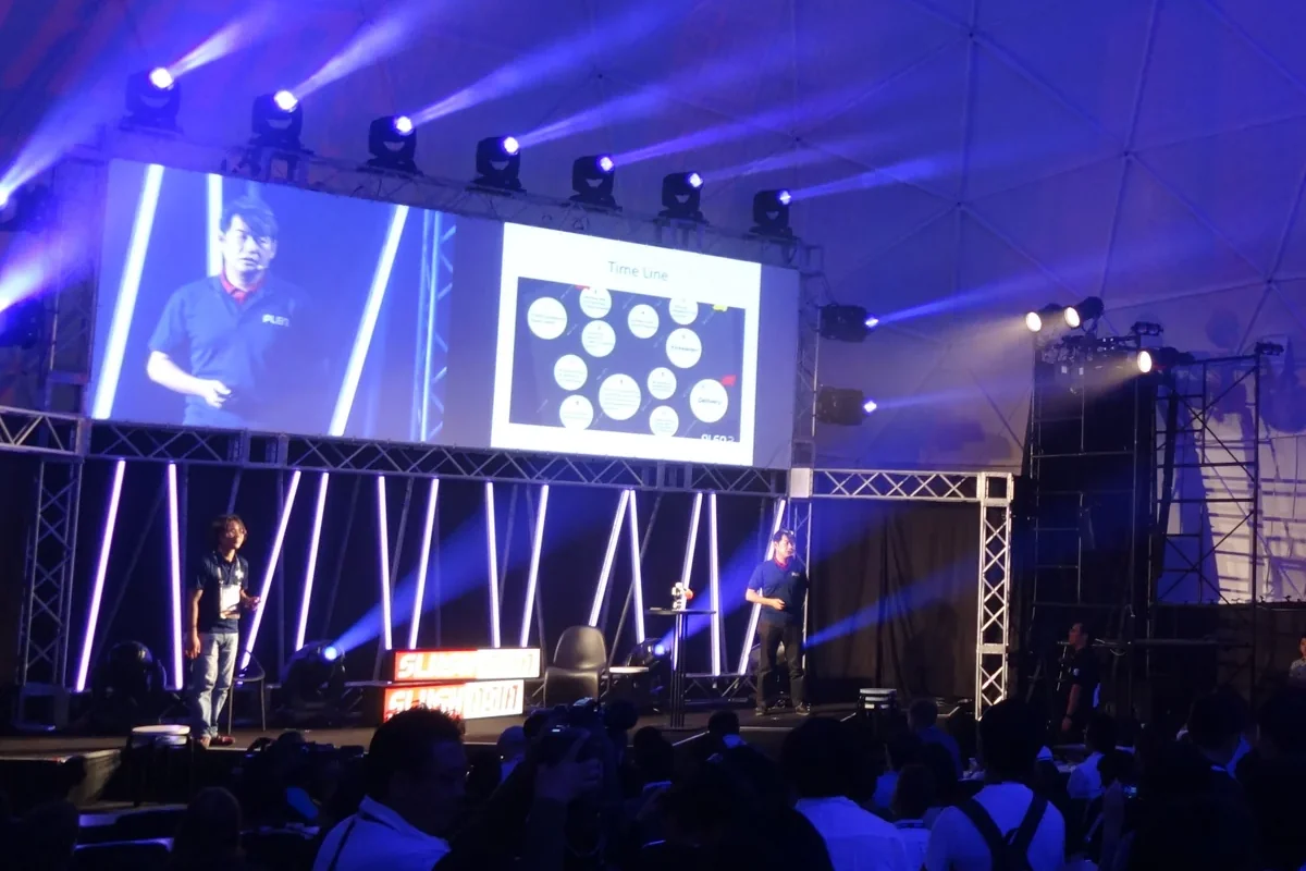 Speaker and projected session on the main stage at Slush Asia 2015, Tokyo · editorial context