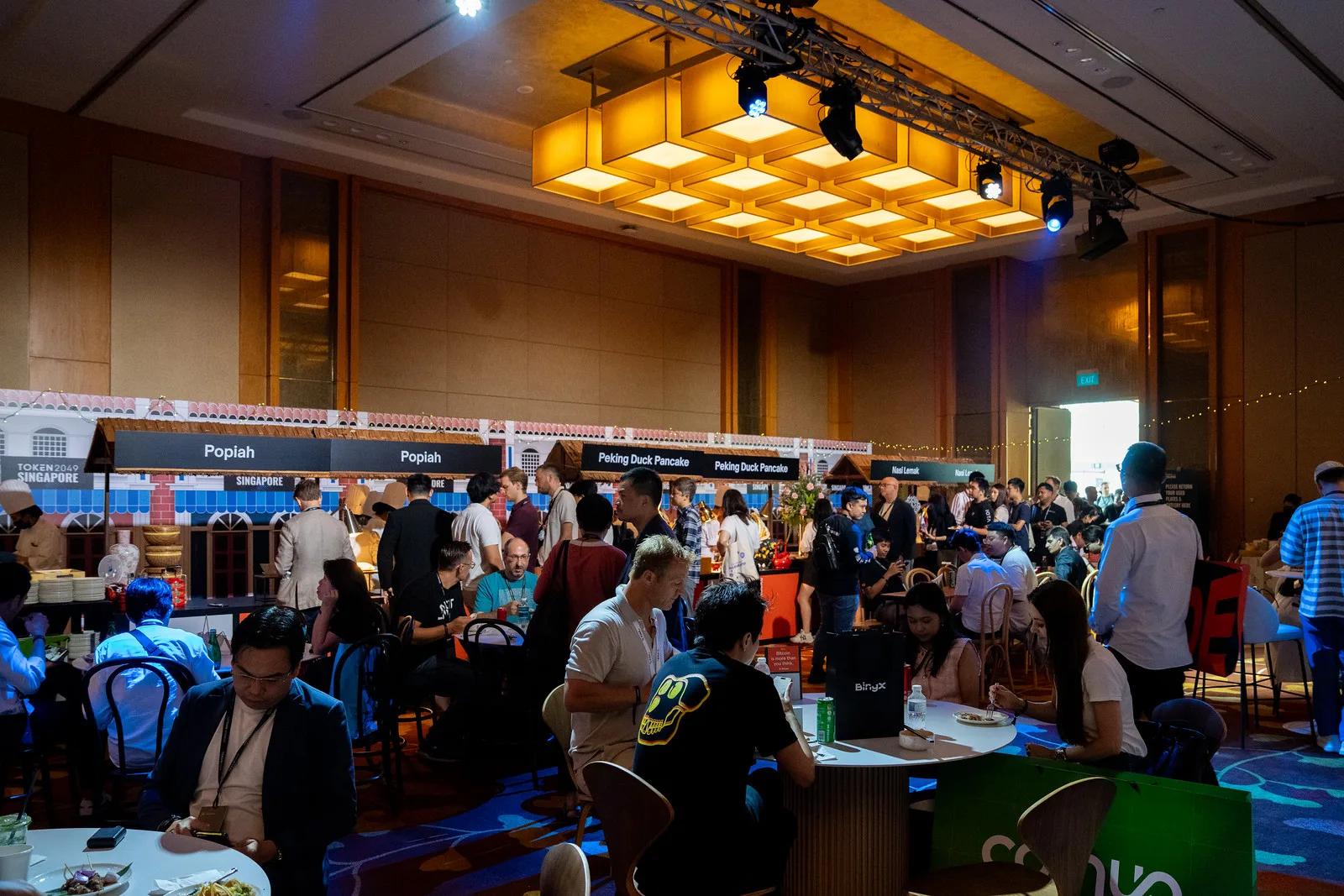 Food hall and networking area at TOKEN2049 Singapore 2025 · editorial context