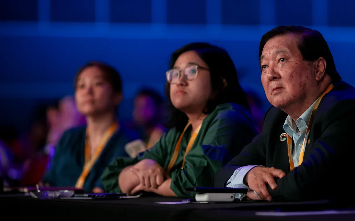 Audience at the Wikimania 2023 opening, Suntec Singapore · editorial context