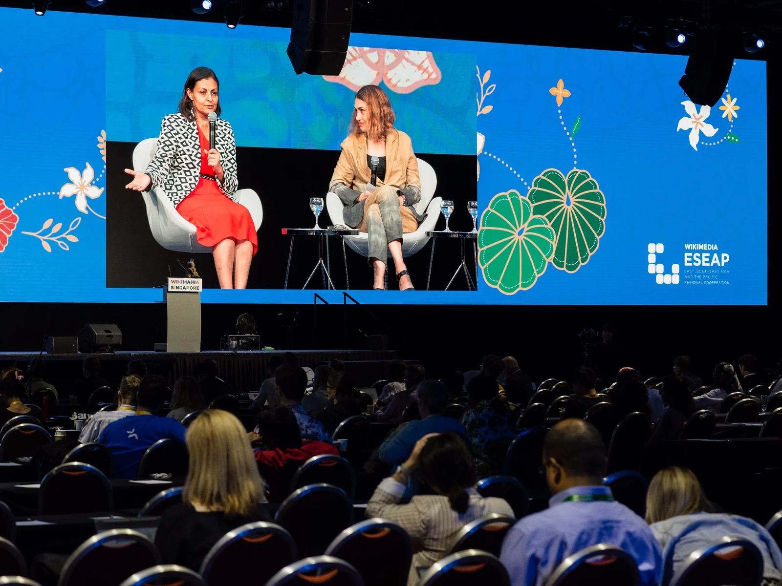 Fireside chat on the main stage at Wikimania 2023, Suntec Singapore · editorial context